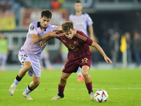 Tommaso Baldanzi attacking midfield of Roma and Italy and Benat Prados central midfield of Athletic Club and Spain compete for the ball duri...