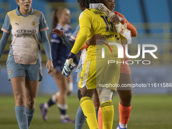 Khiara Keating #35 (GK) of Manchester City W.F.C. and Chiamaka Nnadozie #16 (GK) of Paris FC shake hands at full time during the UEFA Women'...