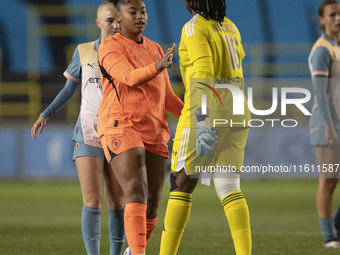 Khiara Keating #35 (GK) of Manchester City W.F.C. and Chiamaka Nnadozie #16 (GK) of Paris FC shake hands at full time during the UEFA Women'...