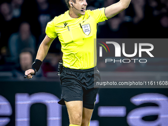 Referee John Brooks officiates the match between Ajax and Besiktas at the Johan Cruijff ArenA for the UEFA Europa League - League phase - Ma...