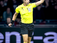 Referee John Brooks officiates the match between Ajax and Besiktas at the Johan Cruijff ArenA for the UEFA Europa League - League phase - Ma...