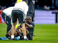 Besiktas JK midfielder Al Musrati gets injured during the match between Ajax and Besiktas at the Johan Cruijff ArenA for the UEFA Europa Lea...