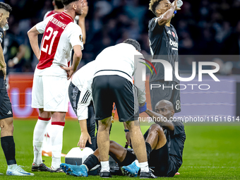 Besiktas JK midfielder Al Musrati gets injured during the match between Ajax and Besiktas at the Johan Cruijff ArenA for the UEFA Europa Lea...