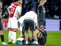 Besiktas JK midfielder Al Musrati gets injured during the match between Ajax and Besiktas at the Johan Cruijff ArenA for the UEFA Europa Lea...