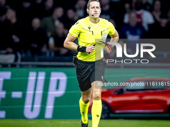 Referee John Brooks officiates the match between Ajax and Besiktas at the Johan Cruijff ArenA for the UEFA Europa League - League phase - Ma...