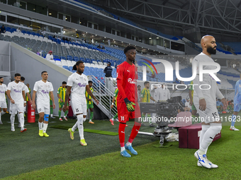 Al-Wakrah SC and Al-Khor SC players walk onto the pitch before the Ooredoo Qatar Stars League 24/25 match between Al-Wakrah SC and Al-Khor S...