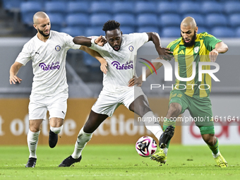 Aissa Belal Laidouni of Al Wakrah SC battles for the ball with Yohan Boli of Al-Khor SC during the Ooredoo Qatar Stars League 24/25 match be...