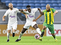 Aissa Belal Laidouni of Al Wakrah SC battles for the ball with Yohan Boli of Al-Khor SC during the Ooredoo Qatar Stars League 24/25 match be...