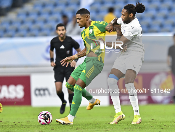 Ricardo Jorge Gomes (L) of Al Wakrah SC battles for the ball with Ruben Afonso Semedo (R) of Al-Khor SC during the Ooredoo Qatar Stars Leagu...