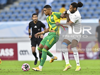 Ricardo Jorge Gomes (L) of Al Wakrah SC battles for the ball with Ruben Afonso Semedo (R) of Al-Khor SC during the Ooredoo Qatar Stars Leagu...