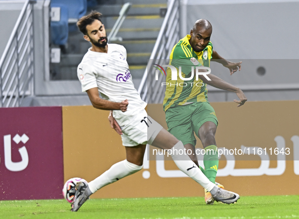 Abdelkarim Hassan (R) of Al Wakrah SC battles for the ball with Abdulrahman Rashed Juma (L) of Al-Khor SC during the Ooredoo Qatar Stars Lea...