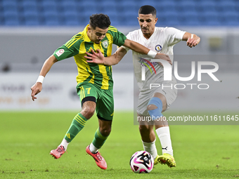 Ayoub Assal (L) of Al Wakrah SC battles for the ball with Gaser Yahia Madani (R) of Al-Khor SC during the Ooredoo Qatar Stars League 24/25 m...