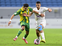 Ayoub Assal (L) of Al Wakrah SC battles for the ball with Gaser Yahia Madani (R) of Al-Khor SC during the Ooredoo Qatar Stars League 24/25 m...