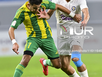 Ayoub Assal (L) of Al Wakrah SC battles for the ball with Gaser Yahia Madani (R) of Al-Khor SC during the Ooredoo Qatar Stars League 24/25 m...