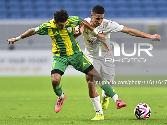 Ayoub Assal (L) of Al Wakrah SC battles for the ball with Gaser Yahia Madani (R) of Al-Khor SC during the Ooredoo Qatar Stars League 24/25 m...