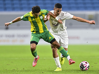 Ayoub Assal (L) of Al Wakrah SC battles for the ball with Gaser Yahia Madani (R) of Al-Khor SC during the Ooredoo Qatar Stars League 24/25 m...