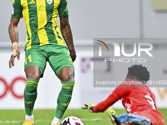 Ricardo Jorge Gomes (L) of Al Wakrah SC battles for the ball with Ahmed Basher Ali (R) of Al-Khor SC during the Ooredoo Qatar Stars League 2...