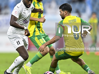 Omar Salah Alosad (#6) of Al Wakrah SC battles for the ball with Yohan Boli (L) of Al-Khor SC during the Ooredoo Qatar Stars League 24/25 ma...