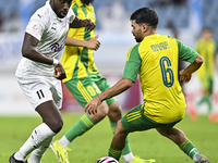 Omar Salah Alosad (#6) of Al Wakrah SC battles for the ball with Yohan Boli (L) of Al-Khor SC during the Ooredoo Qatar Stars League 24/25 ma...