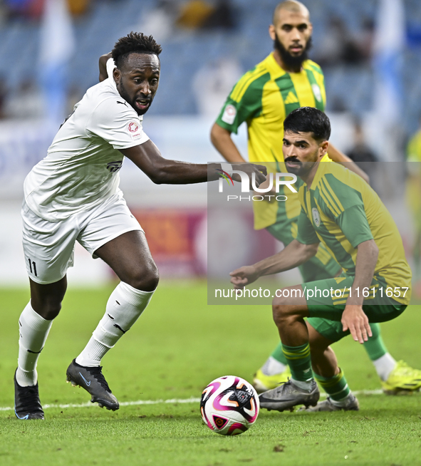 Omar Salah Alosad (#6) of Al Wakrah SC battles for the ball with Yohan Boli (L) of Al-Khor SC during the Ooredoo Qatar Stars League 24/25 ma...