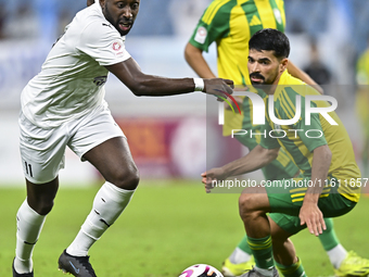 Omar Salah Alosad (#6) of Al Wakrah SC battles for the ball with Yohan Boli (L) of Al-Khor SC during the Ooredoo Qatar Stars League 24/25 ma...