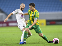 Lucas Mendes (#2) of Al Wakrah SC battles for the ball with Sofiane Hanni (L) of Al-Khor SC during the Ooredoo Qatar Stars League 24/25 matc...