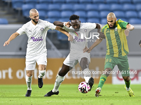 Aissa Belal Laidouni (L) of Al Wakrah SC battles for the ball with Yohan Boli (C) of Al-Khor SC during the Ooredoo Qatar Stars League 24/25...