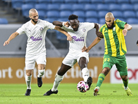 Aissa Belal Laidouni (L) of Al Wakrah SC battles for the ball with Yohan Boli (C) of Al-Khor SC during the Ooredoo Qatar Stars League 24/25...