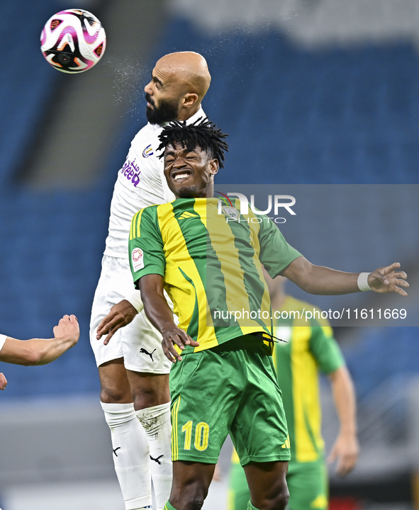 Jacinto Dala (R) of Al Wakrah SC battles for the ball with Naif Mubarak Al-Buriki (L) of Al-Khor SC during the Ooredoo Qatar Stars League 24...