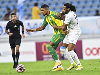 Ricardo Gomes (L) of Al Wakrah SC battles for the ball with Yohan Boli (R) of Al-Khor SC during the Ooredoo Qatar Stars League 24/25 match b...