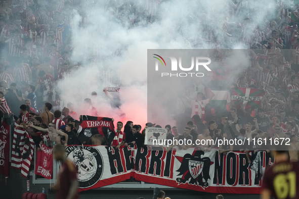 Athletic fans throw flares at Roma fans during the UEFA Europa League 2024/25 League Phase MD1 match between AS Roma and Athletic Club at St...