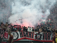 Athletic fans throw flares at Roma fans during the UEFA Europa League 2024/25 League Phase MD1 match between AS Roma and Athletic Club at St...