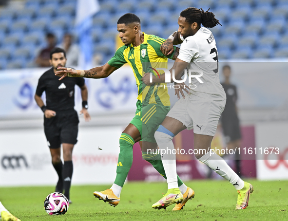 Ricardo Gomes (L) of Al Wakrah SC battles for the ball with Yohan Boli (R) of Al-Khor SC during the Ooredoo Qatar Stars League 24/25 match b...