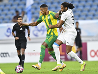 Ricardo Gomes (L) of Al Wakrah SC battles for the ball with Yohan Boli (R) of Al-Khor SC during the Ooredoo Qatar Stars League 24/25 match b...