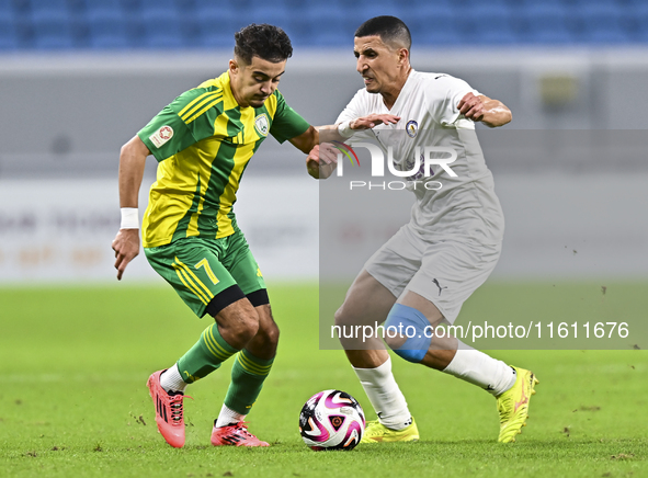 Ayoub Assal (L) of Al Wakrah SC battles for the ball with Gaser Yahia Madani (R) of Al-Khor SC during the Ooredoo Qatar Stars League 24/25 m...