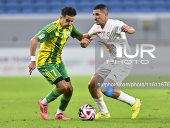 Ayoub Assal (L) of Al Wakrah SC battles for the ball with Gaser Yahia Madani (R) of Al-Khor SC during the Ooredoo Qatar Stars League 24/25 m...