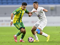 Ayoub Assal (L) of Al Wakrah SC battles for the ball with Gaser Yahia Madani (R) of Al-Khor SC during the Ooredoo Qatar Stars League 24/25 m...