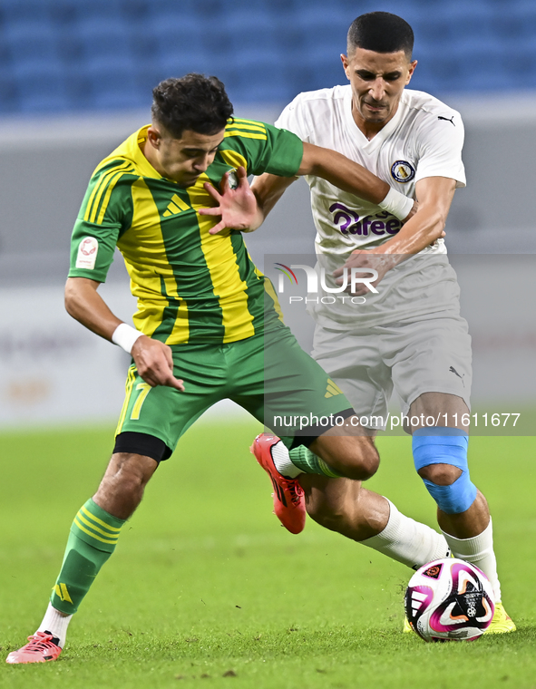 Ayoub Assal (L) of Al Wakrah SC battles for the ball with Gaser Yahia Madani (R) of Al-Khor SC during the Ooredoo Qatar Stars League 24/25 m...