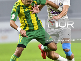 Ayoub Assal (L) of Al Wakrah SC battles for the ball with Gaser Yahia Madani (R) of Al-Khor SC during the Ooredoo Qatar Stars League 24/25 m...