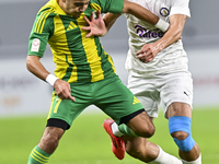 Ayoub Assal (L) of Al Wakrah SC battles for the ball with Gaser Yahia Madani (R) of Al-Khor SC during the Ooredoo Qatar Stars League 24/25 m...