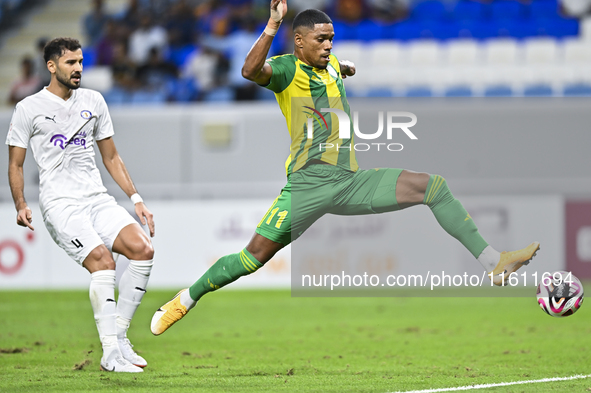 Ricardo Jorge Gomes (R) of Al Wakrah SC battles for the ball with Khaled Radwan Hassan (L) of Al-Khor SC during the Ooredoo Qatar Stars Leag...