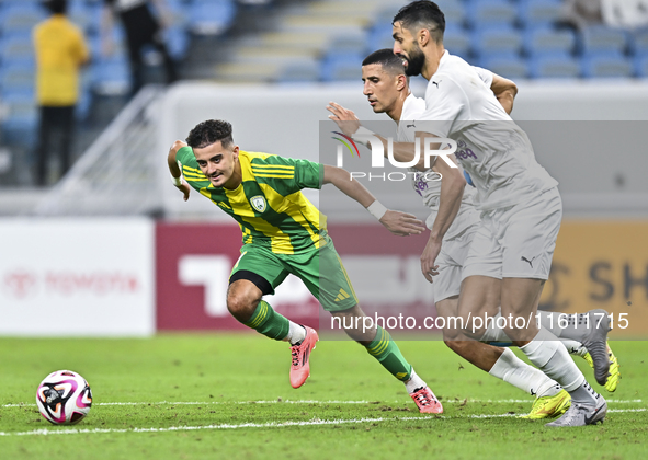 Ayoub Assal (L) of Al Wakrah SC battles for the ball with Gaser Yahia Madani (R) of Al-Khor SC during the Ooredoo Qatar Stars League 24/25 m...