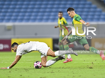 Ayoub Assal (right) of Al Wakrah SC battles for the ball with Adil Rhaili (bottom) of Al-Khor SC during the Ooredoo Qatar Stars League 24/25...