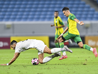 Ayoub Assal (right) of Al Wakrah SC battles for the ball with Adil Rhaili (bottom) of Al-Khor SC during the Ooredoo Qatar Stars League 24/25...