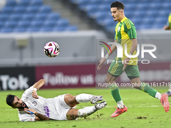 Ayoub Assal (right) of Al Wakrah SC battles for the ball with Adil Rhaili (bottom) of Al-Khor SC during the Ooredoo Qatar Stars League 24/25...