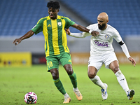 Jacinto Dala (#10) of Al Wakrah SC battles for the ball with Naif Mubarak Al-Buriki (R) of Al-Khor SC during the Ooredoo Qatar Stars League...