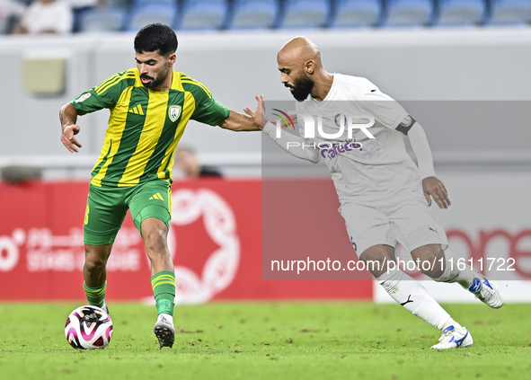 Omar Salah Al Asad of Al Wakrah SC battles for the ball with Naif Mubarak Al-Buriki of Al-Khor SC during the Ooredoo Qatar Stars League 24/2...