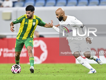 Omar Salah Al Asad of Al Wakrah SC battles for the ball with Naif Mubarak Al-Buriki of Al-Khor SC during the Ooredoo Qatar Stars League 24/2...