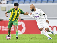 Omar Salah Al Asad of Al Wakrah SC battles for the ball with Naif Mubarak Al-Buriki of Al-Khor SC during the Ooredoo Qatar Stars League 24/2...