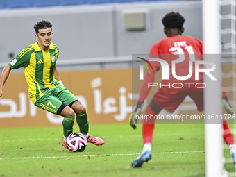 Ayoub Assal (#7) of Al Wakrah SC battles for the ball with Ahmed Basher Ali (R) of Al-Khor SC during the Ooredoo Qatar Stars League 24/25 ma...